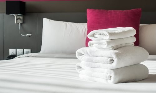 White towel on bed decoration in bedroom interior